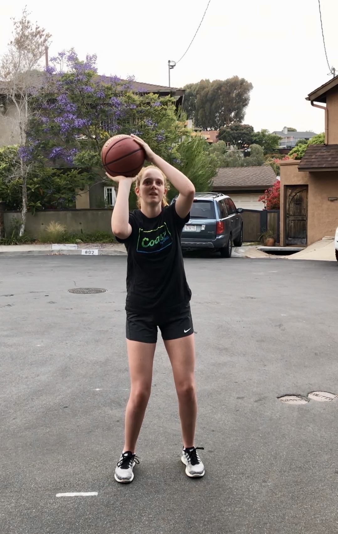 Emma practicing shooting form